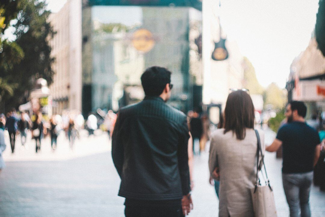 people walking in busy city street